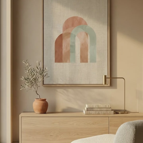 Earth Arch No. 1: A minimalist fine art diptych featuring abstract geometric arches in muted terracotta and sun-baked sage green. The artwork is printed on museum-grade 308gsm Hahnemühle cotton paper, showcased in a premium natural oak frame against a warm, hand-plastered Mediterranean wall with soft, dappled shadows.